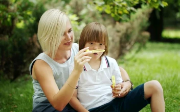 Stock Video Mother Enjoying Time With Her Son In The Par Animated Wallpaper