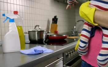 Stock Video Mother Cleaning A Kitchen While She Holds Her Bab Animated Wallpaper