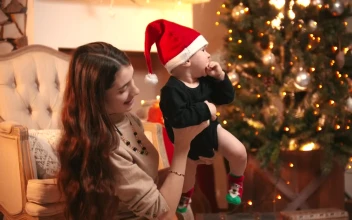 Stock Video Mother Appreciating Her Baby Holding Him In Her Arm Animated Wallpaper