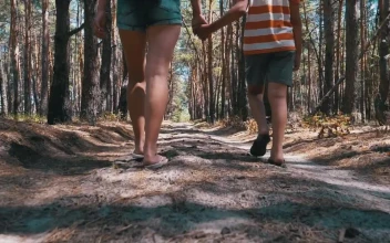 Stock Video Mother And Son Walk Holding Hands In A Fores Animated Wallpaper