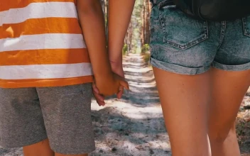 Stock Video Mother And Son Walk Hand In Hand In A Par Animated Wallpaper