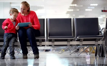 Stock Video Mother And Son Waiting For A Flight Announcemen Animated Wallpaper