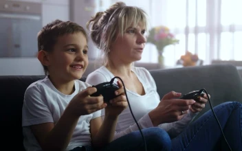 Stock Video Mother And Son Playing An Old Consol Animated Wallpaper