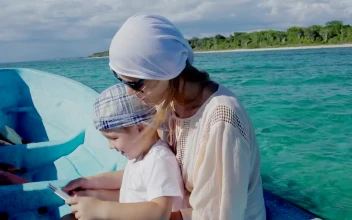 Stock Video Mother And Her Young Boy On A Small Boa Animated Wallpaper