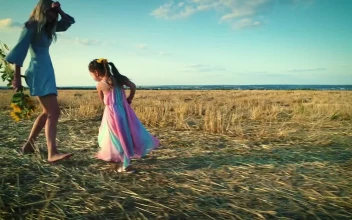 Stock Video Mother And Daughter Play Happily In A Dry Fiel Animated Wallpaper