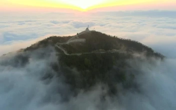 Stock Video Mosque In The Top Of A Cloudy Mountai Animated Wallpaper