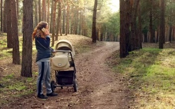 Stock Video Mom Talking On The Phone In The Wood Animated Wallpaper