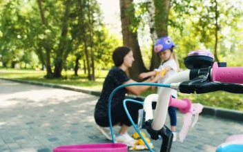 Stock Video Mom Puts Protective Equipment On Her Daughte Animated Wallpaper