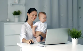 Stock Video Mom On Her Computer While Taking Care Of Her So Animated Wallpaper