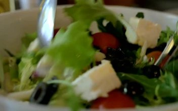 Stock Video Mixing Up A Greek Salad Ready For Servin Animated Wallpaper