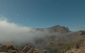 Stock Video Mist Falling Over A Mountai Animated Wallpaper