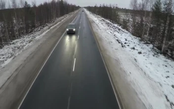 Stock Video Minivan Heading Down A Frozen Roa Animated Wallpaper