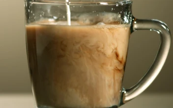 Stock Video Milk Poured Into Coffee In Slow Motio Animated Wallpaper