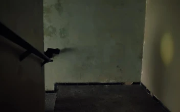 Stock Video Mercenary Going Up The Stairs Aiming His Gu Animated Wallpaper