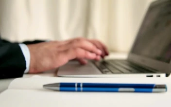 Stock Video Men Taking Note While Browsing In A Lapto Animated Wallpaper