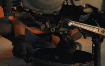 Stock Video Mechanic Repairing A Motorcycle Engin Animated Wallpaper