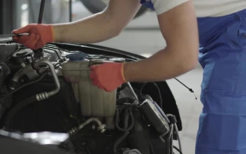 Stock Video Mechanic Repairing A Car Engin Animated Wallpaper