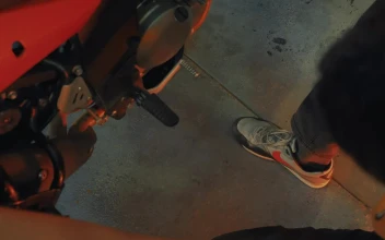 Stock Video Mechanic Looking At A Motorcycle In A Worksho Animated Wallpaper