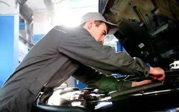 Stock Video Mechanic In Overalls Working Under The Hood Of A Ca Animated Wallpaper