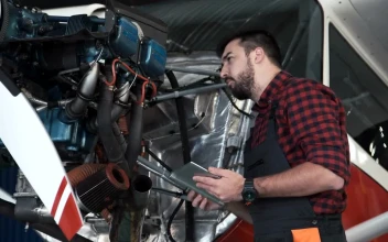 Stock Video Mechanic Inspecting An Airplane Engin Animated Wallpaper