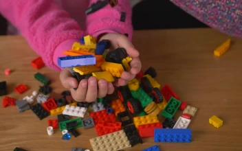 Stock Video Many Lego Pieces Falling Into The Hands Of A Gir Animated Wallpaper