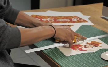 Stock Video Mans Hands Cut A Printed Illustration With A Cutte Animated Wallpaper