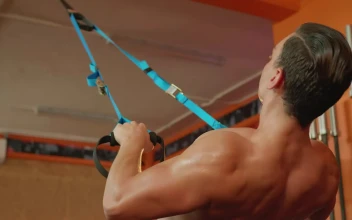 Stock Video Man Working Out With Straps In A Gy Animated Wallpaper