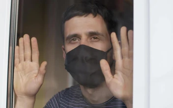 Stock Video Man With Mask Looks Longingly From His Windo Animated Wallpaper