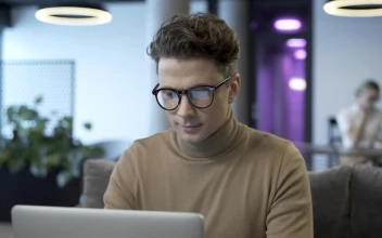 Stock Video Man With Glasses Working On A Lapto Animated Wallpaper