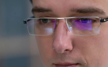 Stock Video Man With Glasses Looking At Monito Animated Wallpaper