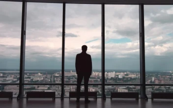 Stock Video Man Wearing A Suit Looking Out Towards A Cit Animated Wallpaper