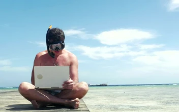 Stock Video Man Wearing A Snorkel While Using A Lapto Animated Wallpaper