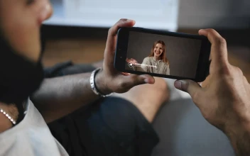 Stock Video Man Watching A Video On His Smartphon Animated Wallpaper