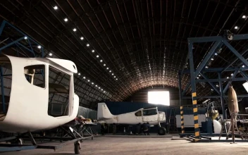 Stock Video Man Walking In An Aircraft Hanga Animated Wallpaper