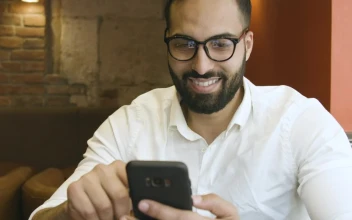Stock Video Man Using Mobile App Reflected In Glasse Animated Wallpaper