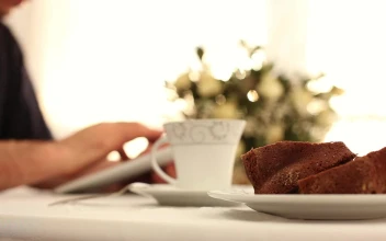 Stock Video Man Using His Table During Breakfas Animated Wallpaper
