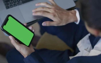 Stock Video Man Using His Computer And Cell Phon Animated Wallpaper