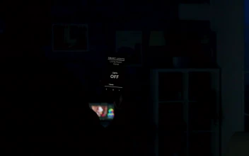 Stock Video Man Using Future App To Control Lighting From Mobile Phon Animated Wallpaper