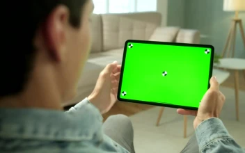 Stock Video Man Using Green Screen Tablet In Neutral Living Roo Animated Wallpaper