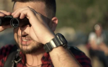 Stock Video Man Using Binoculars And Friends Looking At Ma Animated Wallpaper