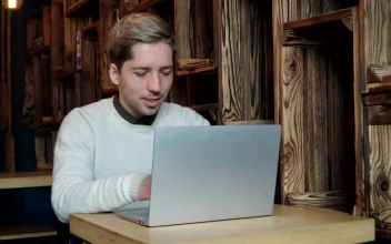 Stock Video Man Typing On A Laptop In A Caf Animated Wallpaper