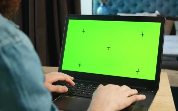 Stock Video Man Types On Greenscreen Laptop In Bedroo Animated Wallpaper