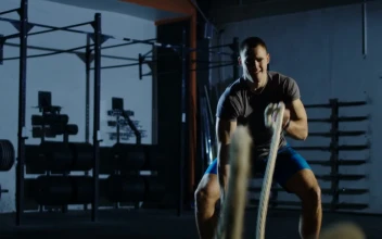 Stock Video Man Training With Ropes In The Gy Animated Wallpaper