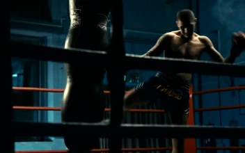 Stock Video Man Training With Punching Bag In The Gy Animated Wallpaper