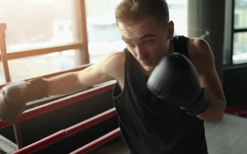 Stock Video Man Training With Gloves In Boxing Rin Animated Wallpaper