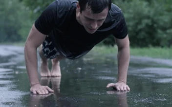 Stock Video Man Training Outdoors While Rainin Animated Wallpaper