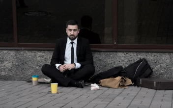 Stock Video Man Taking Off His Tie Sitting On The Stree Animated Wallpaper