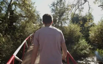 Stock Video Man Taking A Walk Through A Park In Morocc Animated Wallpaper