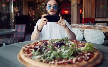 Stock Video Man Takes Photo Of Pizza With Mobile Phon Animated Wallpaper