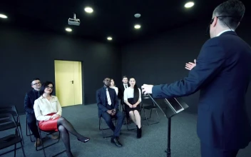 Stock Video Man Speaking In Front Of A Small Audienc Animated Wallpaper
